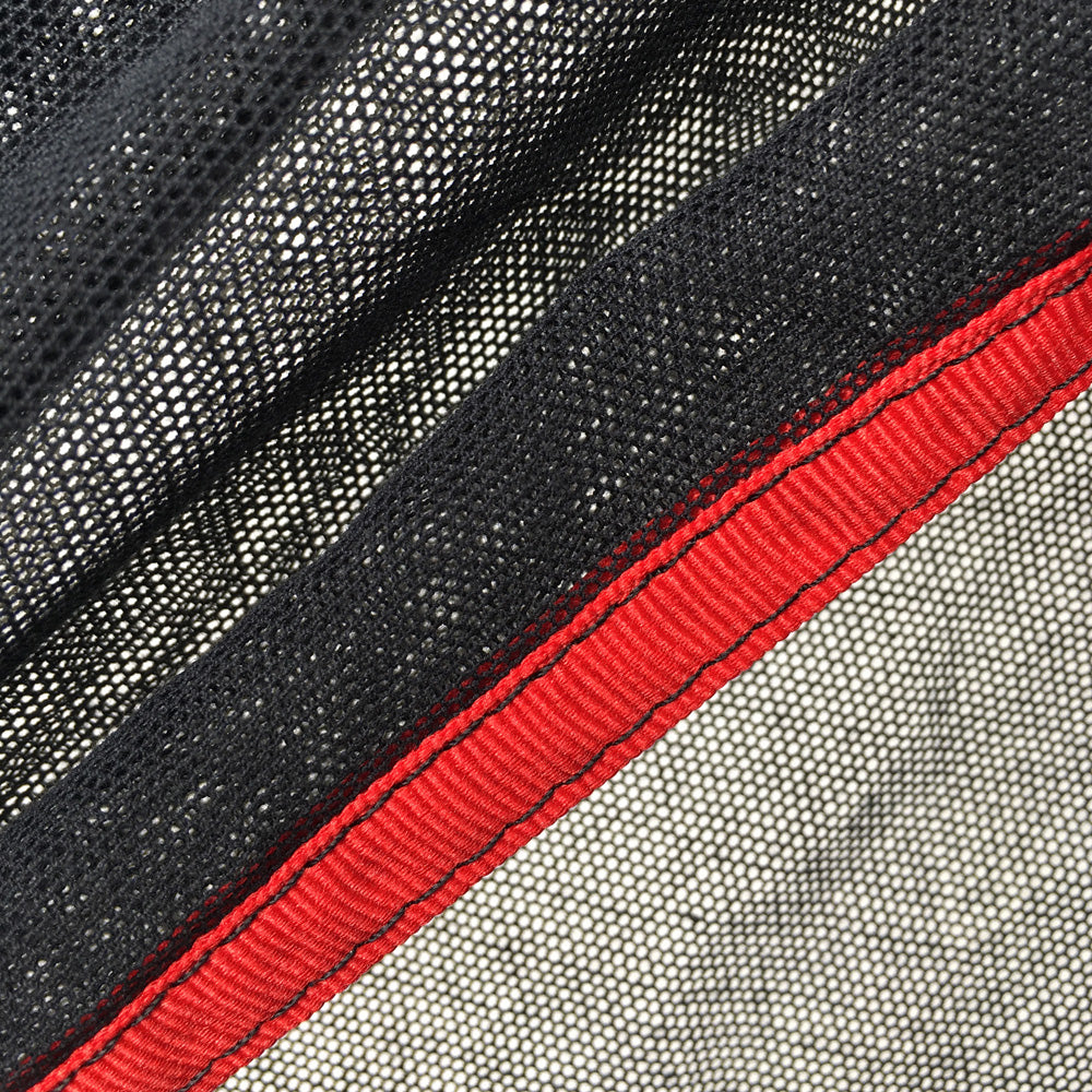 Close-up of Double Bobbinette Scrim Panel Fabric showcasing black and red edges, ideal for photography use.