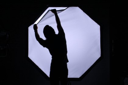 silhouette in front of a lighted screen
